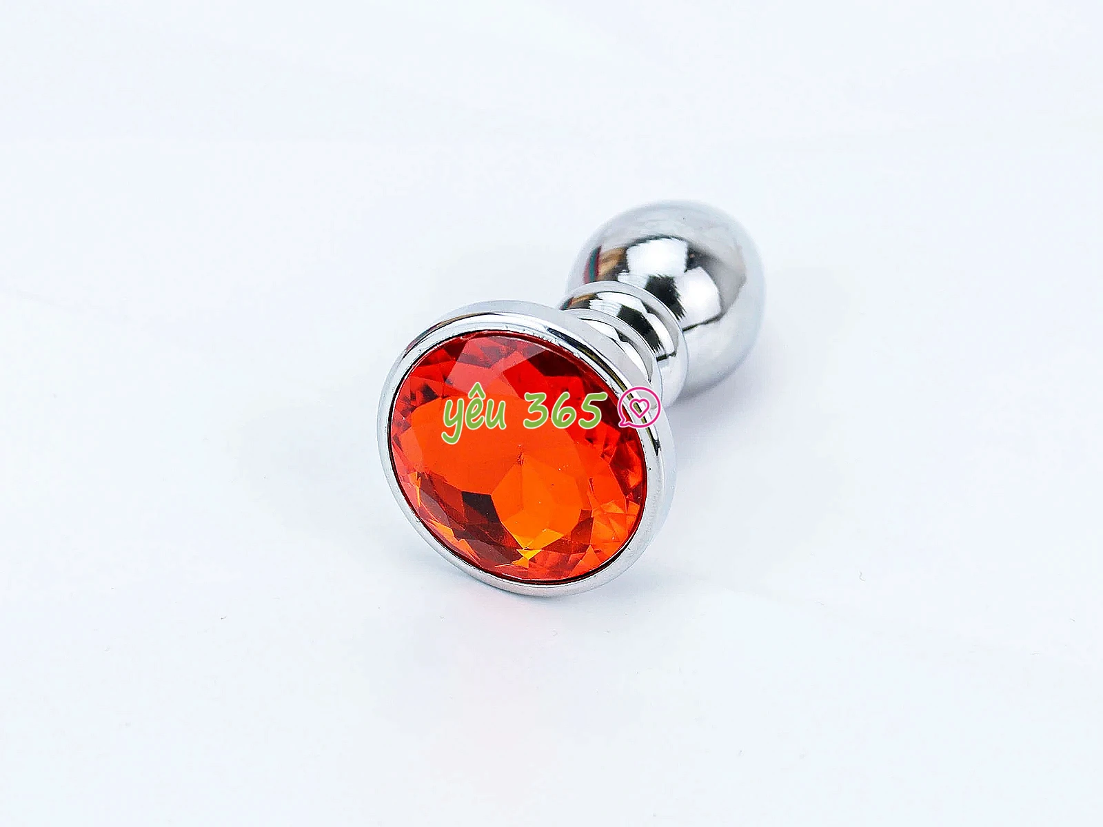 Đồ chơi kích hậu Inox xoắn ốc đuôi pha lê màu cam